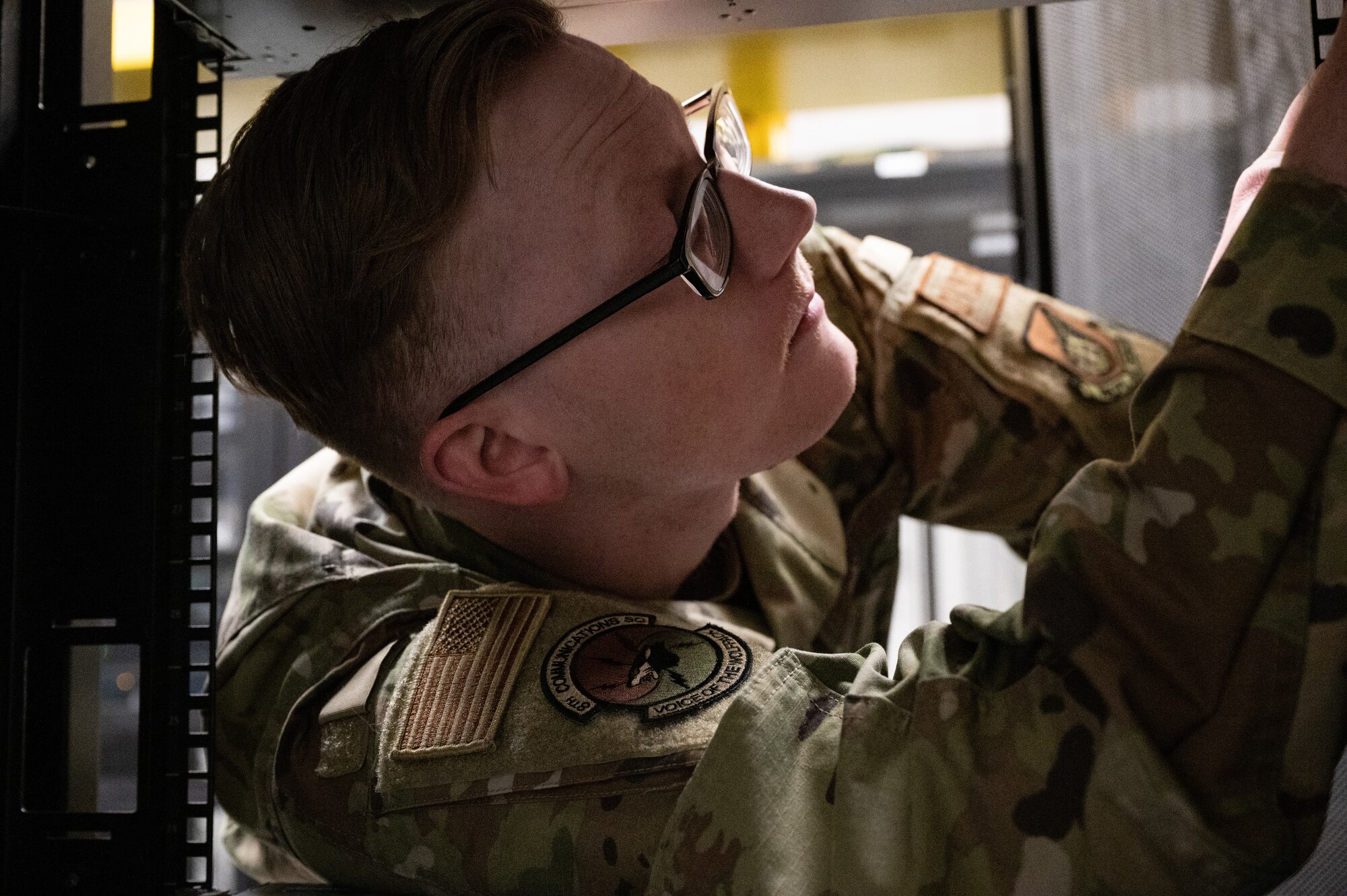 Staff Sgt. Spencer Pearce, 8th Communications Squadron cyber defense vulnerability NCO in charge, inspects a server rack at Kunsan Air Base, Republic of Korea, Jan. 9, 2023. In order to eliminate a network vulnerability, sometimes the cyber defense office will physically change a part of a server to perform updates to the systems. (U.S. Air Force photo by Staff Sgt. Sadie Colbert)