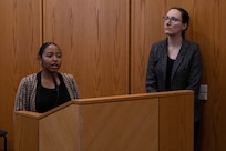 Naval Surface Warfare Center, Philadelphia Division chemist Jasmine Richardson (left) and chemical engineer Amanda Peters (right) discuss effective and inclusive interdisciplinary teams during the Many Voices Capstone Project briefing at NSWCPD on Nov. 17, 2022. Many Voices is a program designed to emphasize the importance of diversity through inclusivity. (U.S. Navy Photo by Sgt. Jermaine Sullivan/Released)
