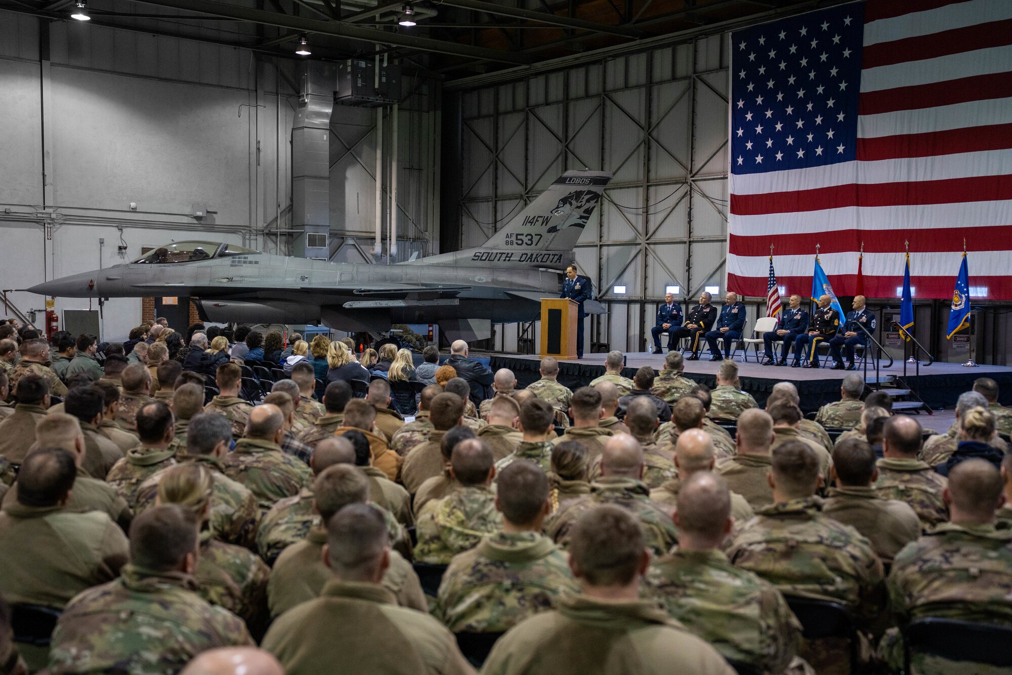 U.S. Air Force Col. Brandon Eskam, newly appointed 114th Fighter Wing base commander, Joe Foss Field, addresses Airmen during a change of command ceremony Jan. 8, 2023, Sioux Falls, South Dakota.