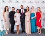 The 2022 Coast Guard Spouse of the Year, Abbi McCracken, (pictured fourth from the left) stands with other military spouses and friends at an Armed Forces Insurance Military Spouse of the Year event held in May 2022. Pictured from left to right are: Heba Abdelaal, Vincent Toth, Monica Bassett, Abbi McCracken, Sarah Streyder and Cindy Donivan Meili. (USCG photo)