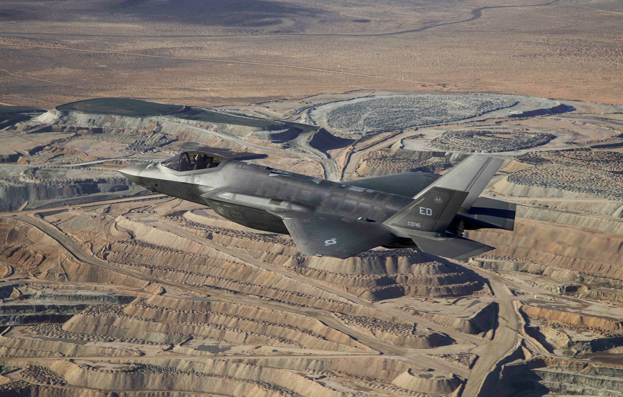 An F-35A, in flight above the Mojave Desert in California, January 6, 2023. A developmental test team from the 461st Flight Test Squadron conducted the first flight of an F-35 in the Technology Refresh 3 (TR-3) configuration at Edwards Air Force Base, California. The 50-minute flight, which took the jet to 35,000 feet at speeds just shy of the speed of sound above the desert, marked the start of an extensive flight test campaign. TR-3 provides the computational horsepower to support modernized Block 4 capabilities. The F-35 Joint Program Office is the Department of Defense's focal point for the 5th-generation strike aircraft for the Navy, Air Force, Marines, and our allies. The F-35 is the premier multi-mission, 5th-generation weapon system. Its ability to collect, analyze and share data is a force multiplier that enhances all assets in the battle space: with stealth technology, advanced sensors, weapons capacity, and range. The F-35 has been operational since July 2015 and is the most lethal, survivable, and interoperable fighter aircraft ever built.