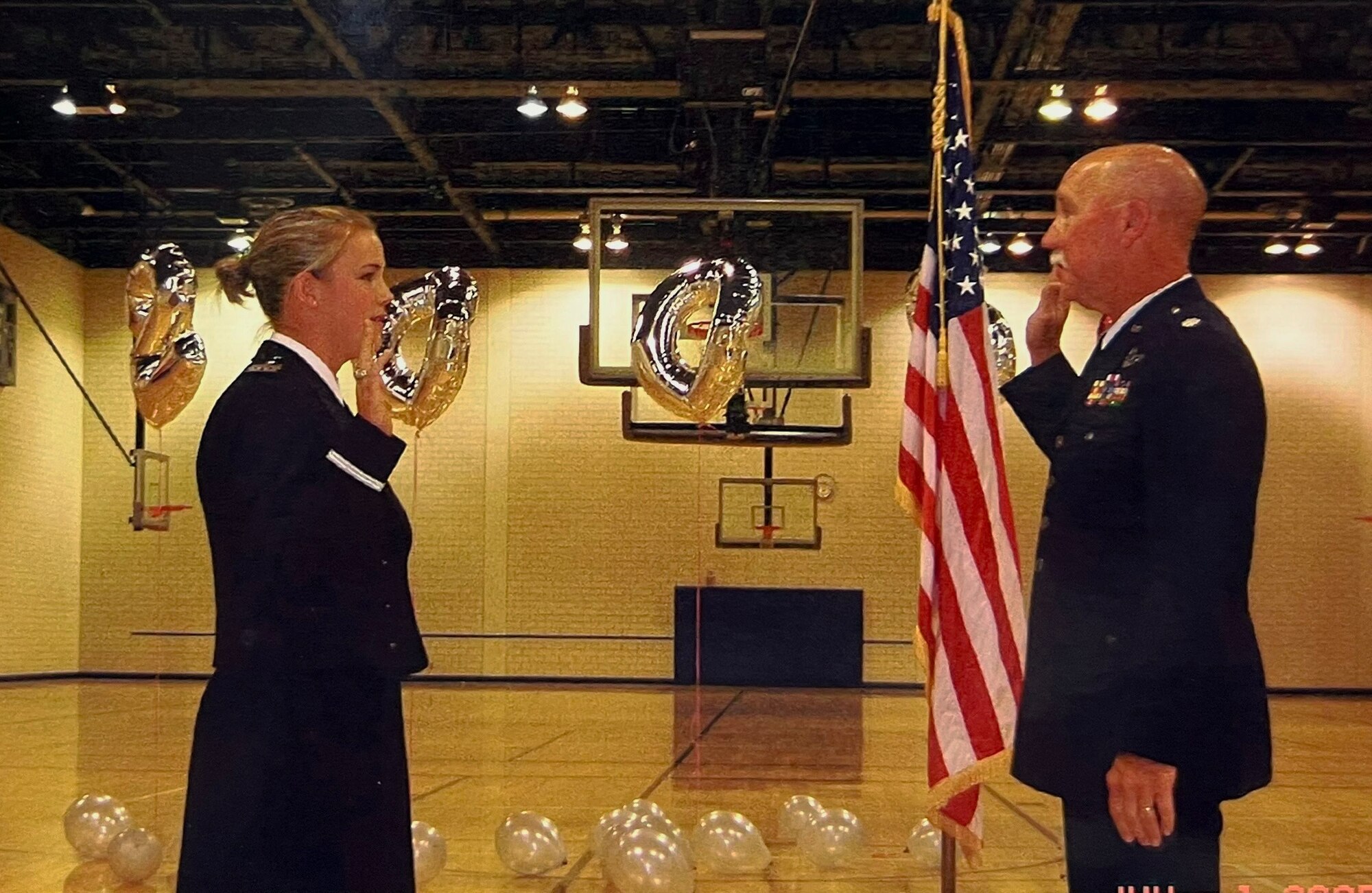 Lt. Col Mason Honeycutt administers the oath of office for Lt. Julie Honeycutt.