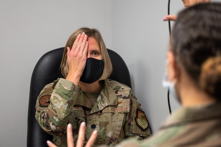 U.S. Air Force Tech. Sgt. Kiara Warren, 316th Medical Squadron optometry technician, conducts an eye examination for U.S. Air Force Lt. Col. Sarah Brehm, Air Force fellow, at Joint Base Anacostia-Bolling, Washington, D.C., Oct. 5, 2022. The 316th MDS Optometry Clinic provides comprehensive primary eye care for service members across the National Capital Region. (U.S. Air Force photo by Kristen Wong)
