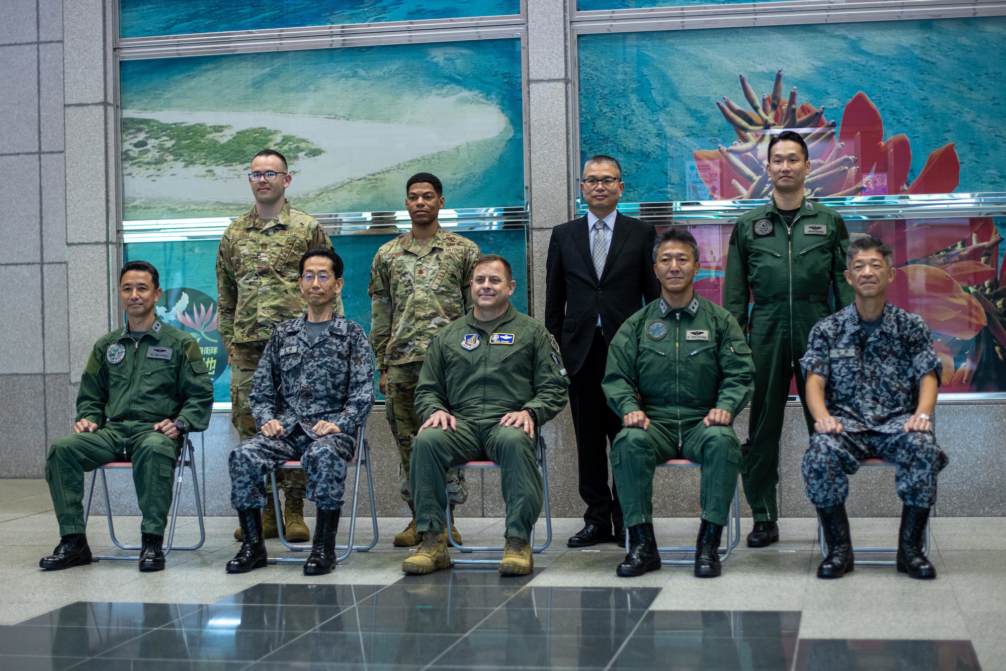 Airmen and Japanese service members pose for a picture.