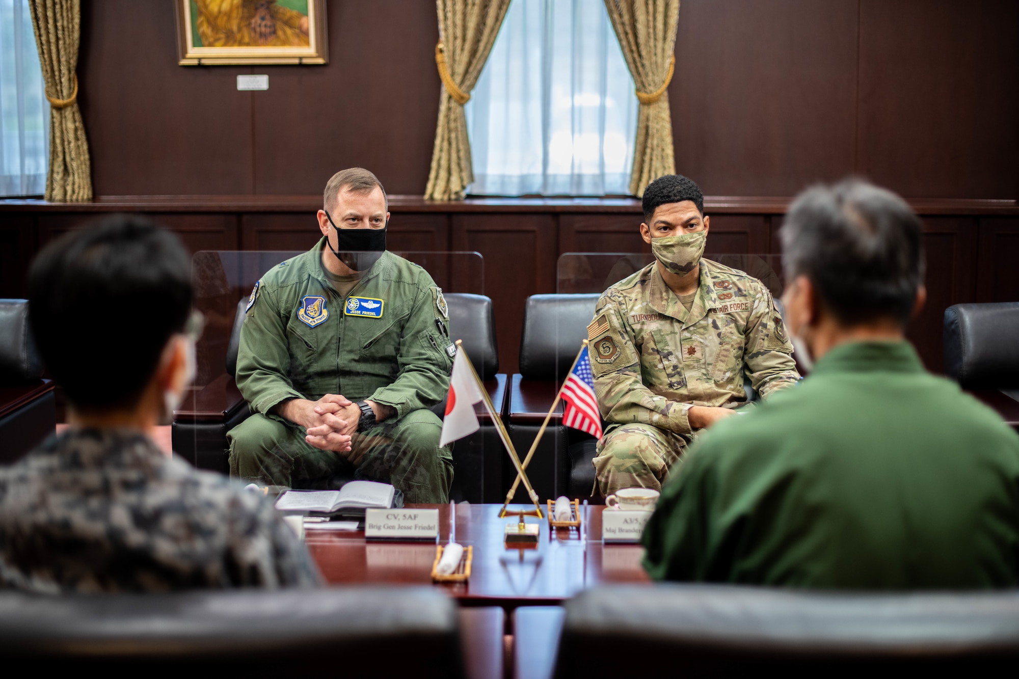 Airmen meet with Japanese service members.