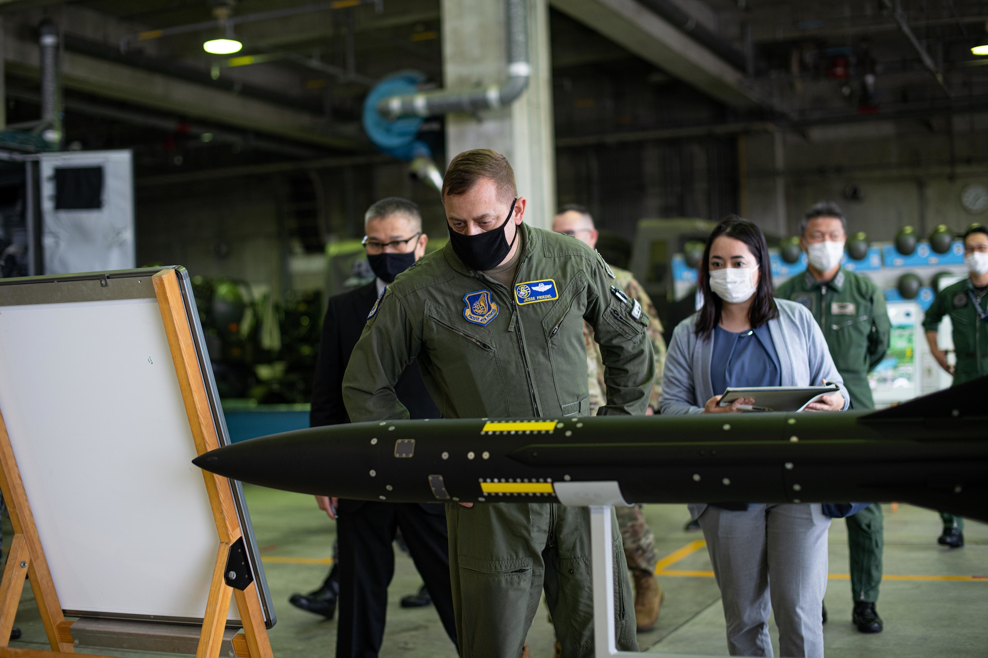 An Airman looks at a missile.