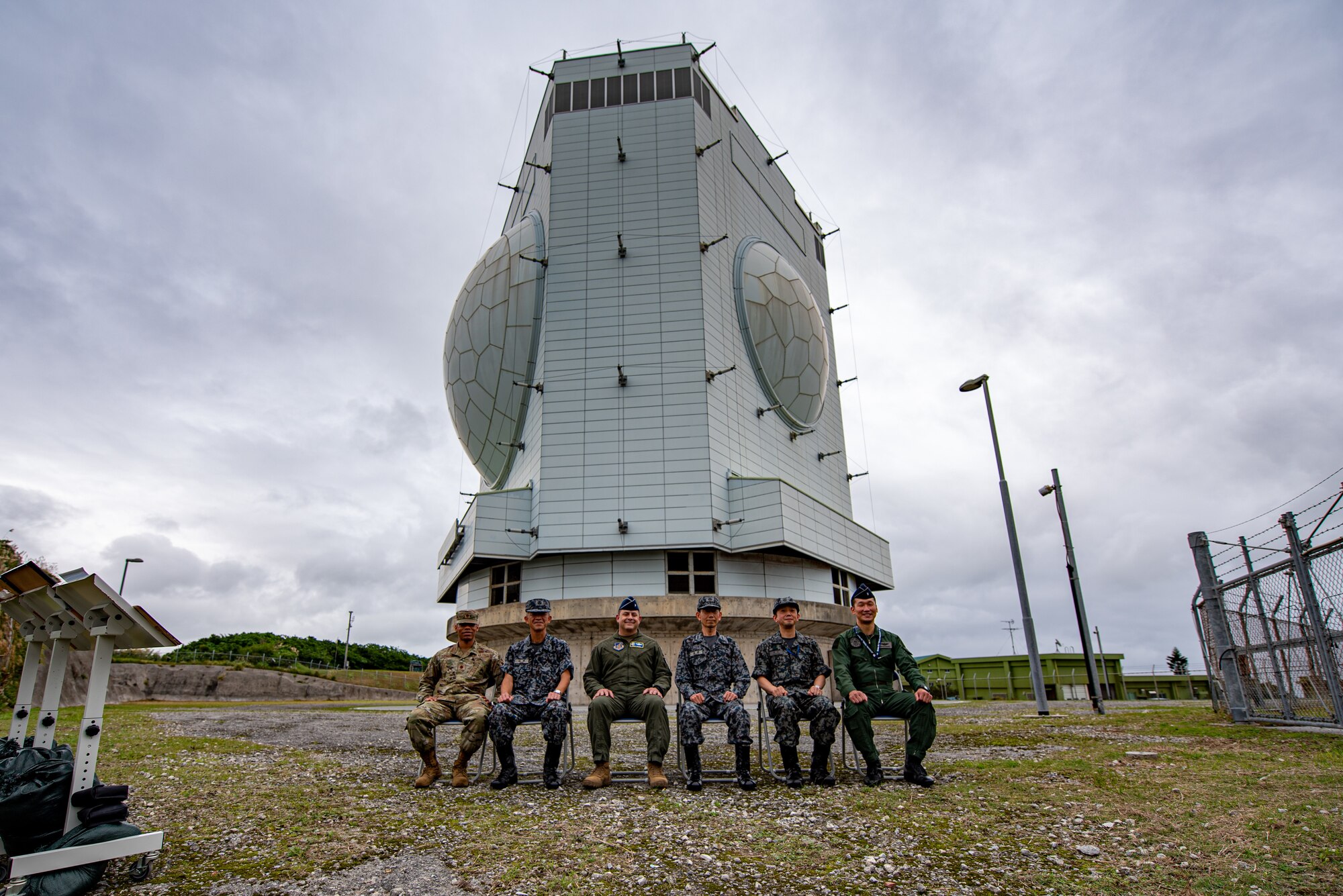 Airmen and Japanese service members pose for a picture.