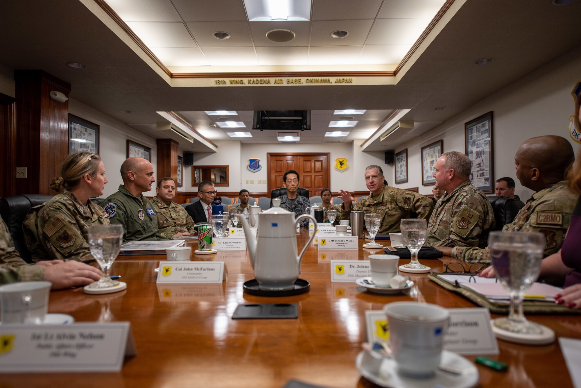 Airmen brief a Japanese service member.