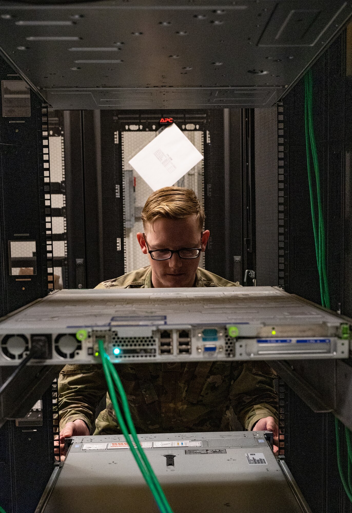 Staff Sgt. Spencer Pearce, 8th Communications Squadron cyber defense vulnerability NCO in charge, checks a server rack at Kunsan Air Base, Republic of Korea, Jan. 9, 2023. The cyber defense 365-team can remotely correct a user’s cyber threat protective measures, one of the many ways adversaries try to infiltrate an installation’s network. (U.S. Air Force photo by Staff Sgt. Sadie Colbert)