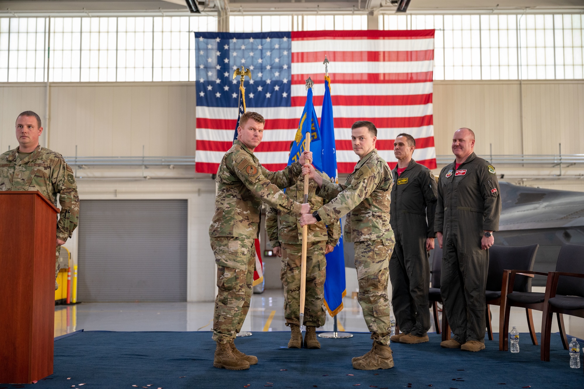 U.S. Air Force Capt. Trent Amerson, 27th Fighter Squadron director of maintenance, right, assumes command of the 71st Fighter Generation Squadron from Col. Neal Van Houten, 1st Maintenance Group commander, at Joint Base Langley-Eustis, Virginia, Jan. 6, 2023.
