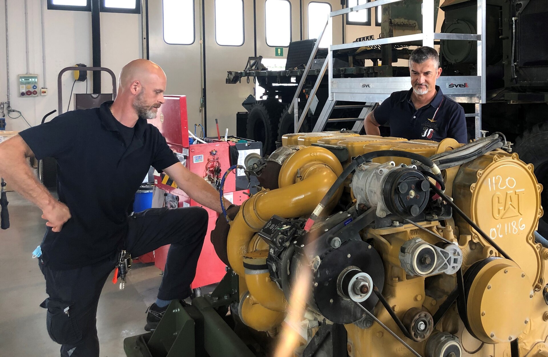 Luca Gianello (left) is an Italian local national employee with Installation Material Maintenance Activity, Logistics Readiness Center Italy, 405th Army Field Support Brigade. He said growing up near Vicenza, Italy, he’s always had an affinity for Soldiers and Army life. The Italian local national employee has worked for the U.S. Army almost 24 years ago, and he assumed a new position as maintenance operations specialist, Jan. 1. (U.S. Army courtesy photo)
