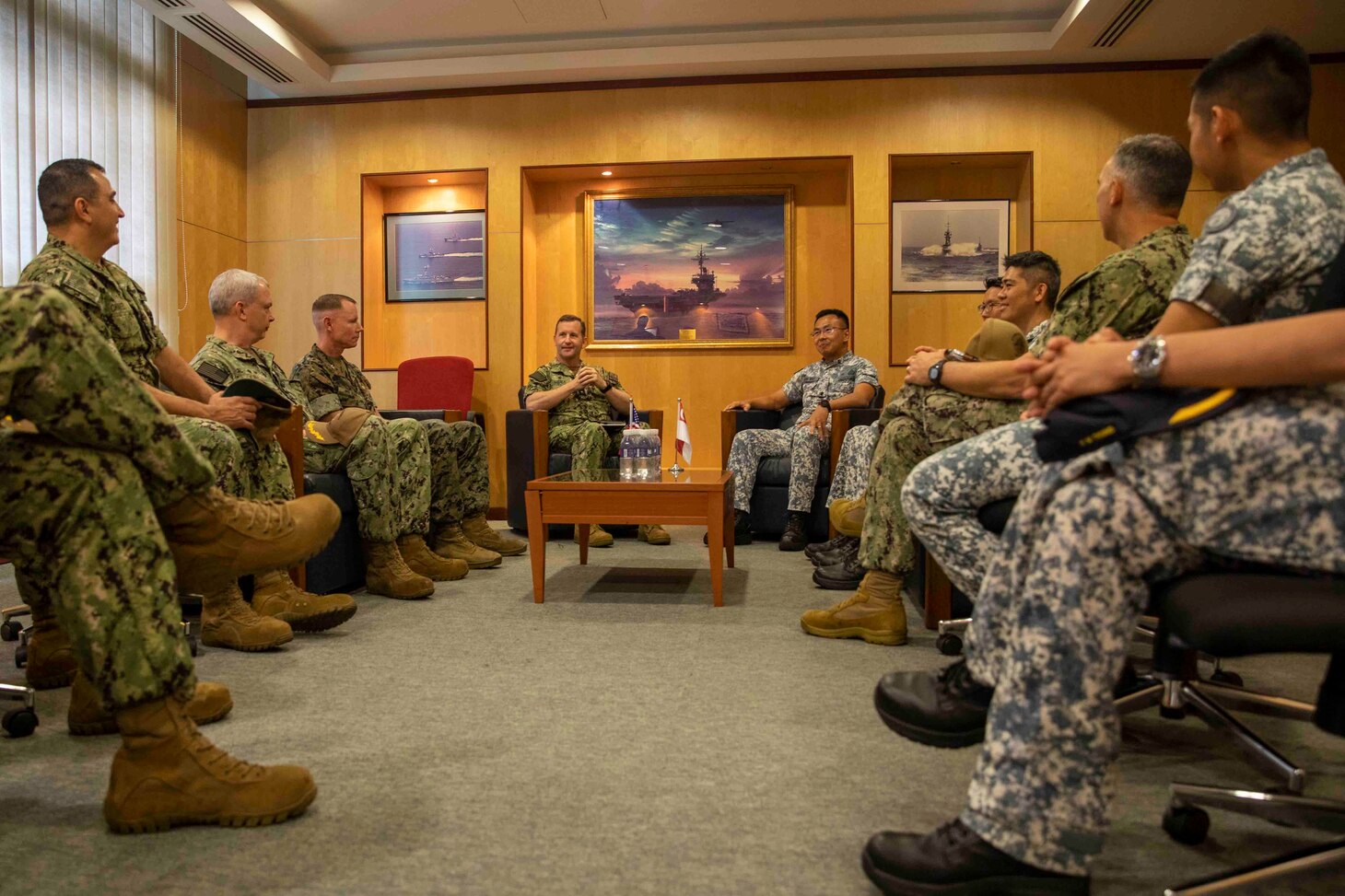 SINGAPORE (Jan. 9, 2023) Rear Adm. Mark Melson, Commander, Logistics Group Western Pacific/Task Force 73, meets with Rear Adm. Sean Wat, Fleet Commander, Republic of Singapore Navy (RSN), prior to the opening ceremony of Cooperation Afloat Readiness and Training (CARAT)/Marine Exercise (MAREX) Singapore 2022, Jan. 9, 2023. CARAT Singapore is a bilateral exercise between Singapore and the United States designed to promote regional security cooperation, maintain and strengthen maritime partnerships, and enhance maritime cooperation. In its 28th, the CARAT series is comprised of multinational exercises, designed to enhance U.S. and partner forces’ abilities to operate together in response to traditional and non-traditional maritime security challenges in the Indo-Pacific region. The Makin Island Amphibious Ready Group, comprised of Makin Island, Murtha and amphibious transport dock USS Anchorage (LPD 23), is operating in the U.S. 7th Fleet area of operations with the embarked 13th Marine Expeditionary Unit to enhance interoperability with Allies and partners and serve as a ready-response force to defend peace and maintain stability in the Indo-Pacific region. (U.S. Navy photo by Mass Communication Specialist 3rd Class Kendra Helmbrecht)