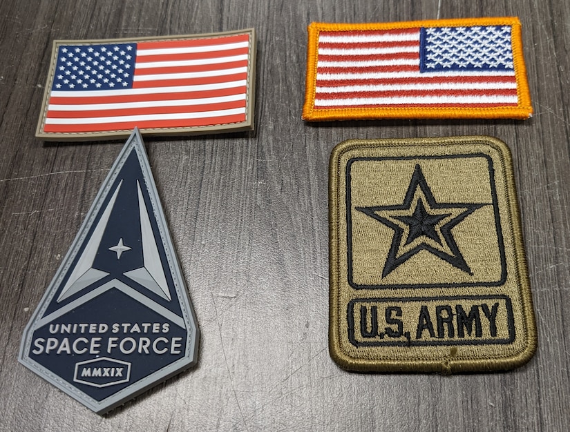 Two patches made of PVC and two patches made of textiles sit beside each other for comparison.