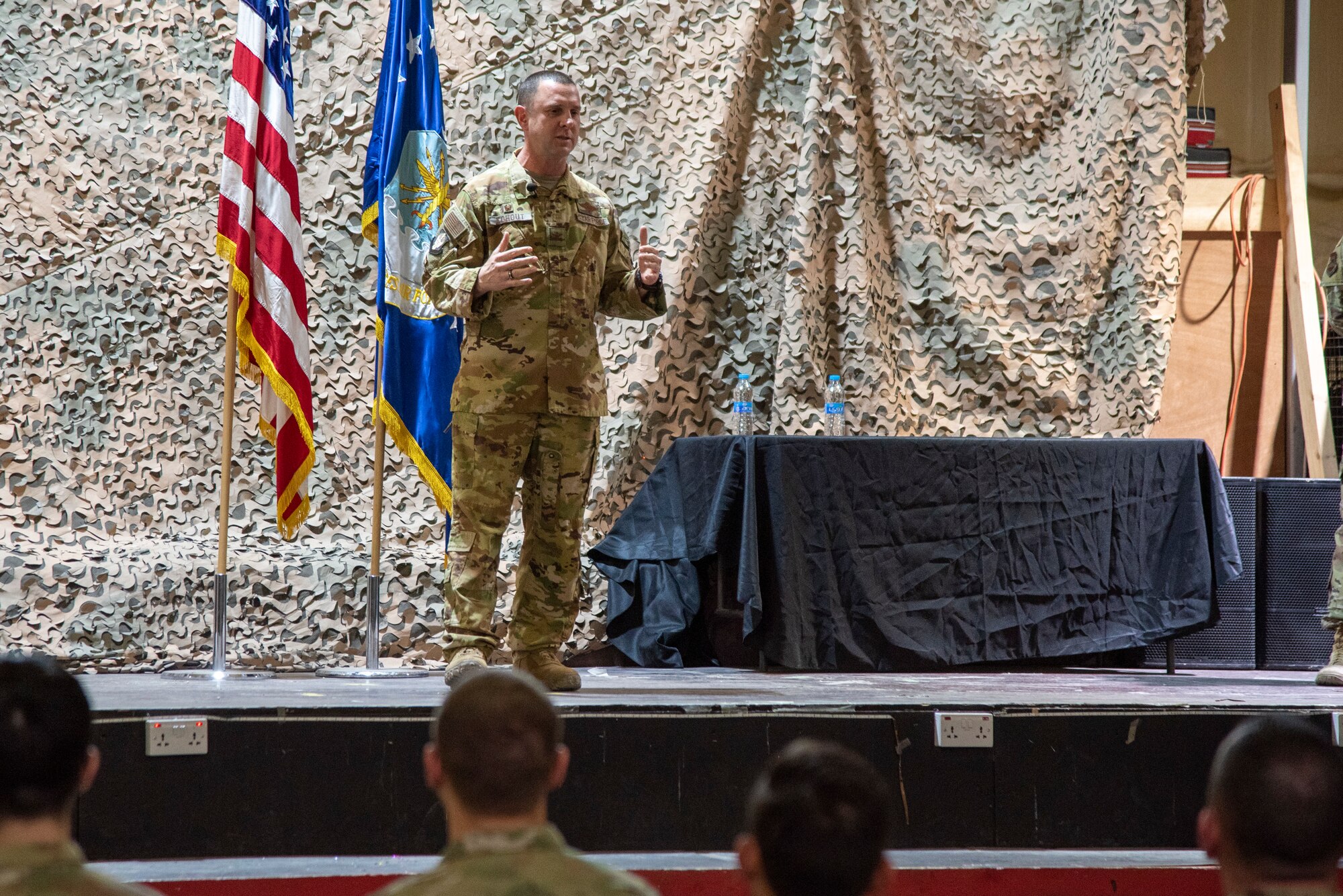 Col. Kouhout speaks at a Red Tail University graduation ceremony at an undisclosed location, Southwest Asia, Jan. 5, 2023. Red Tail University is an Airman-led education organization that teaches developing Airmen about leadership and quality-of-life topics. (U.S. Air Force photo by: Tech. Sgt. Jim Bentley)