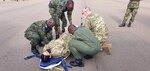 Rwandan Armed Forces soldiers and U.S. Nebraska Air National Guard medical personnel load a simulated patient onto a gurney for a patient transfer exercise in Kigali, Rwanda, in March 2022 as part of the African Peacekeeping Rapid Response Partnership program.