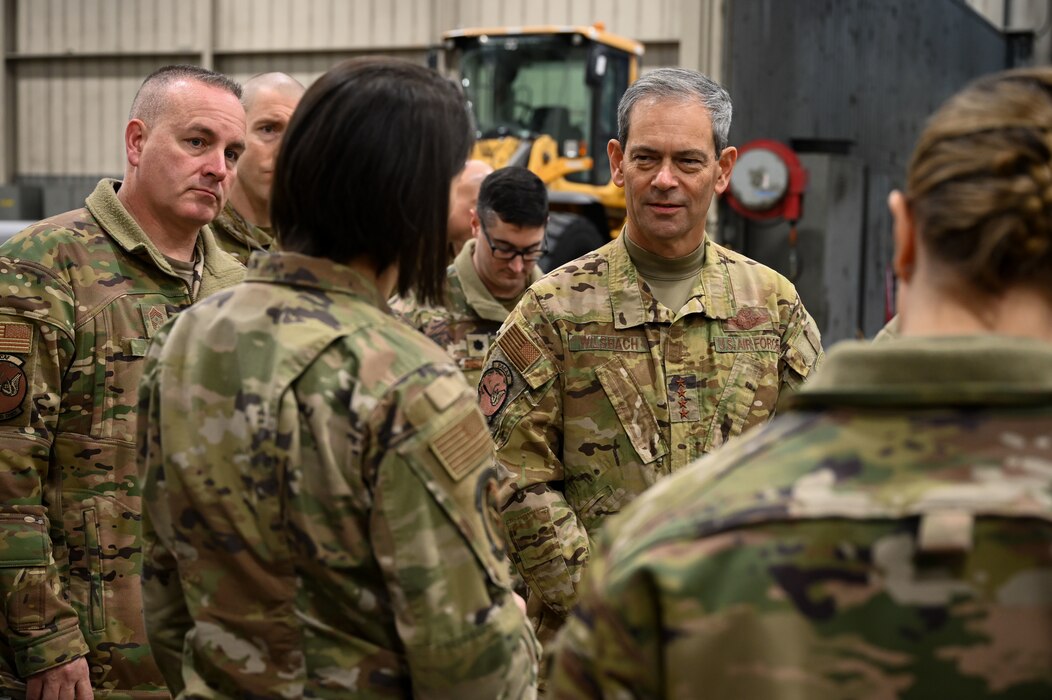 U.S. Air Force Gen. Ken Wilsbach, the Pacific Air Forces commander (right), and Chief Master Sgt. David R. Wolfe, the PACAF command chief (left), received a brief from Maj. Kathryn Stuard, the 354th Civil Engineering Squadron operations flight commander, during a base visit at Eielson Air Force Base, Alaska, Jan. 4, 2023.