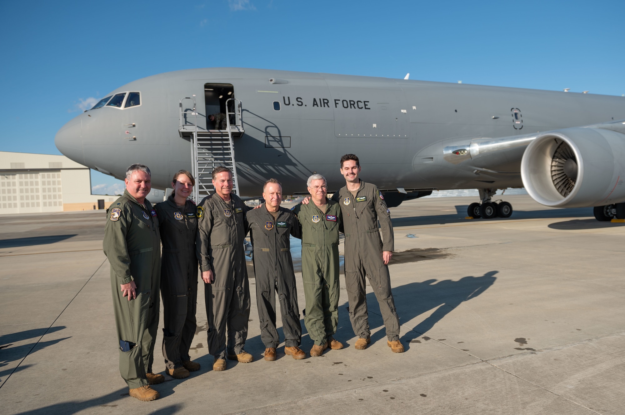 Chief Master Sgt. Tony Parris, 77th Air Refueling Squadron boom operator, poses for photo with members assigned to the 77th ARS at Seymour Johnson Air Force Base, North Carolina, Jan. 5, 2023. Parris had finished his fini flight before his retirement. (U.S. Air Force Photo by Airman 1st Class Rebecca Sirimarco-Lang)