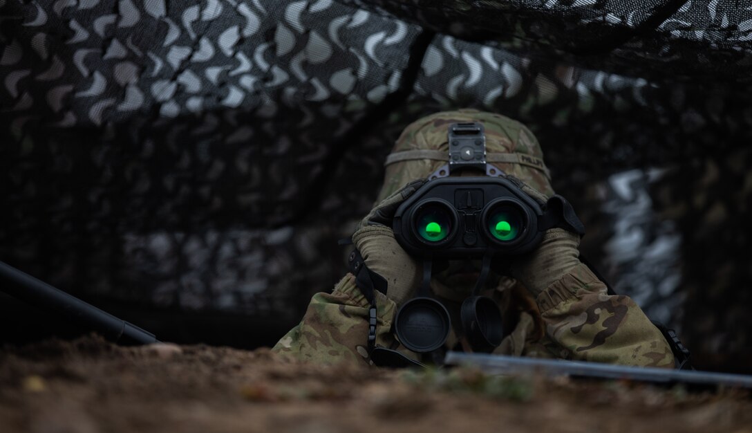 U.S. Army Spc. Chelsea Phillips, a fire support specialist assigned to 6th Squadron, 9th Cavalry Regiment, 3rd Armored Brigade Combat Team, 1st Cavalry Division (3-1 ABCT), operationally assigned to the 1st Infantry Division (1 ID), locates targets during Hammer 22, a two week training operation alongside Finland’s Army Headquarters, Armored Brigade, Pori Brigade, Karelia Brigade, Uti Jaeger Regiment and Logistics Department of the Defense Forces, in Niinisalo, Finland, Nov. 5, 2022. The 3-1 ABCT is among other units under the 1 ID working alongside allies and regional security partners to provide combat-credible forces to V Corps, America’s forward deployed corps in Europe. (U.S. Army photo by Spc. Charles Leitner)