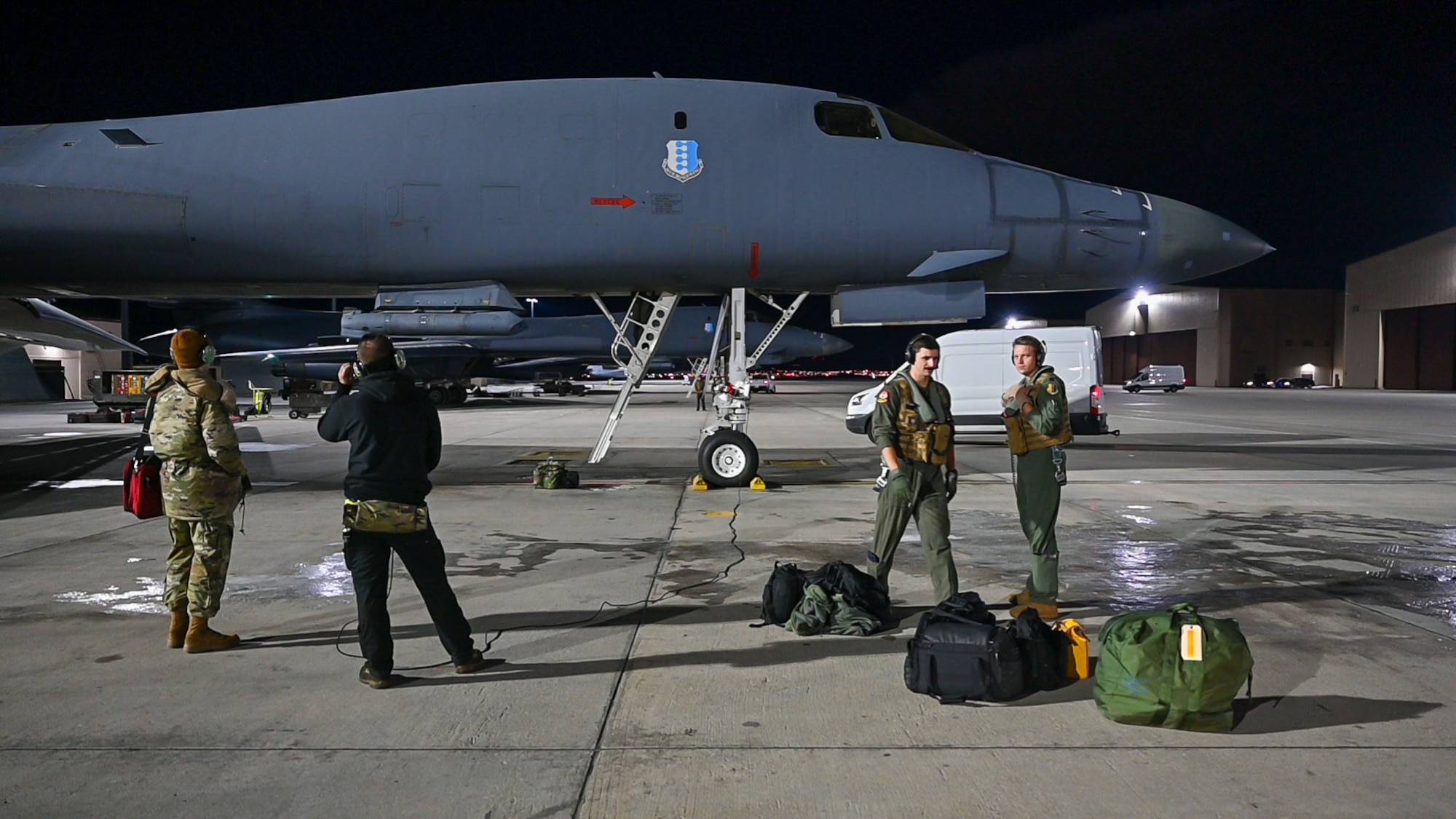 Aircrew from the 37th Bomb Squadron load a B-1B Lancer for a CONUS-to-CONUS (C2C) mission at Ellsworth Air Force Base, South Dakota, Jan. 9, 2023. The B-1B is a long-range, multi-role bomber that carries the largest payload of precision guided and unguided munitions in the Air Force inventory. (U.S. Air Force photo by Airman 1st Class Adam Olson)