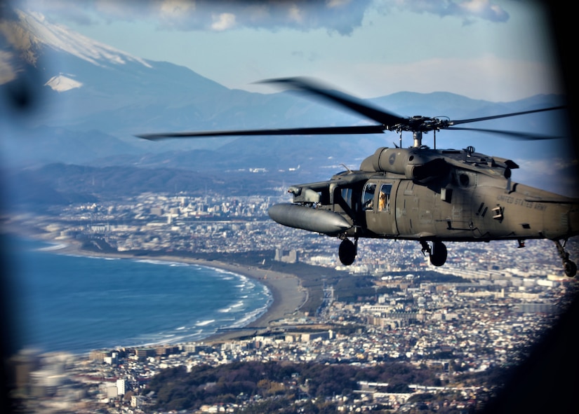 Chopper flies near the symbol of Japan – Mount Fuji.