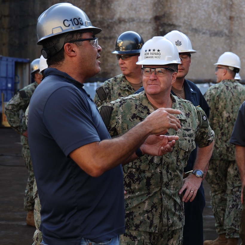 Chris Mason (left), project manager for the maintenance availability of USS Michael Murphy (DDG 112), provides maintenance updates to Adm. Samuel Paparo (right), commander, U.S. Pacific Fleet, Jan. 10, 2023. Paparo met with shipyard maintenance personnel from Pearl Harbor Naval Shipyard and Intermediate Maintenance Facility (PHNSY & IMF), along with Sailors from Michael Murphy. (Official U.S. Navy photo by Lt. j.g. Thea Beltran)