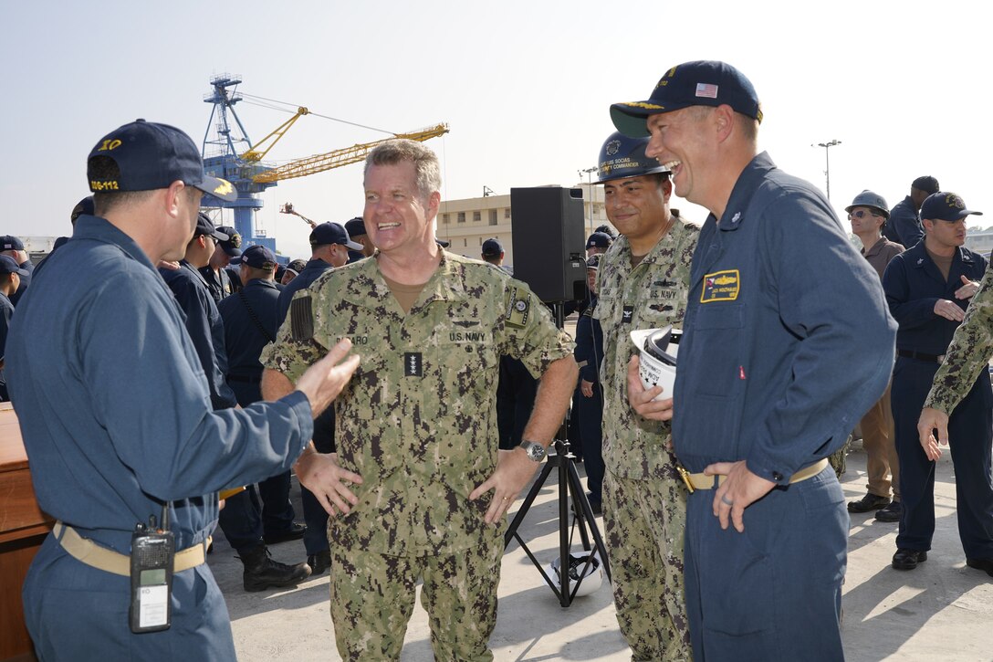 Adm. Samuel Paparo (center), commander, U.S. Pacific Fleet, meets with Cmdr. Jonathan B. Greenwald (left), executive officer, USS Michael Murphy (DDG 112) and Cmdr. John Holthaus (right), commanding officer, USS Michael Murphy (DDG 112), currently undergoing a maintenance availability in Dry Dock #4 of Pearl Harbor Naval Shipyard and Intermediate Maintenance Facility, Jan. 10, 2023. (Official U.S. Navy photo by Marc Ayalin)
