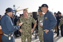 Adm. Samuel Paparo (center), commander, U.S. Pacific Fleet, meets with Cmdr. Jonathan B. Greenwald (left), executive officer, USS Michael Murphy (DDG 112) and Cmdr. John Holthaus (right), commanding officer, USS Michael Murphy (DDG 112), currently undergoing a maintenance availability in Dry Dock #4 of Pearl Harbor Naval Shipyard and Intermediate Maintenance Facility, Jan. 10, 2023. (Official U.S. Navy photo by Marc Ayalin)