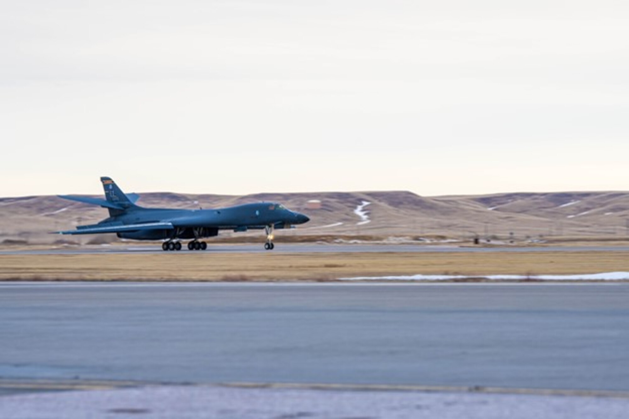 A U.S. Air Force B-1B Lancer, assigned to the 37th Bomb Squadron, lands at Ellsworth Air Force Base, South Dakota, after completing a long-duration CONUS-to-CONUS (C2C) mission to the Indo-Pacific  Jan. 10, 2023. Together with our Allies and partners, the United States is dedicated to maintaining a region comprised of nations that adhere to international law. (U.S. Air Force photo by A1C Josephine Pepin)