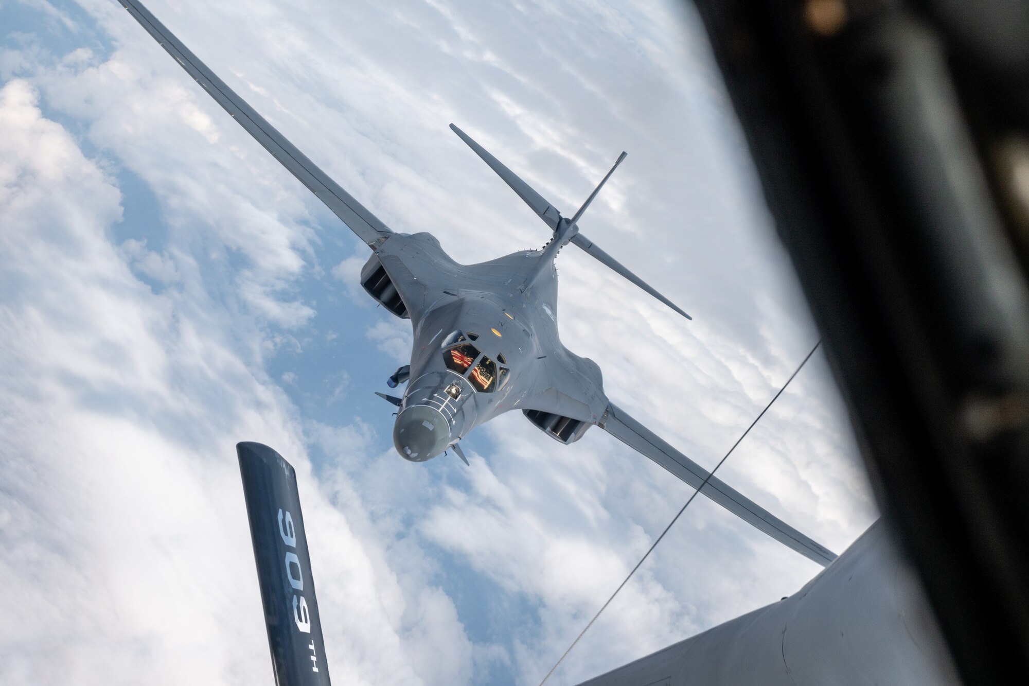Aircraft approaches another aircraft for in-flight refueling