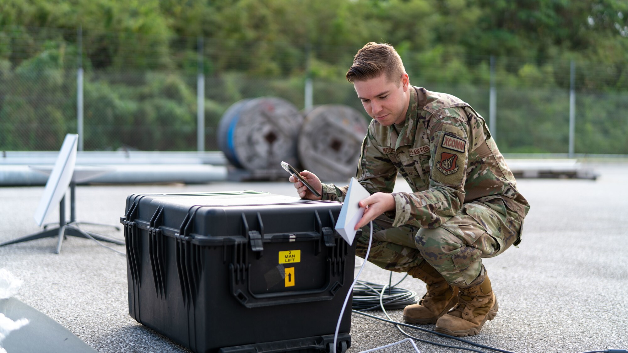 An Airman sets up a modem.