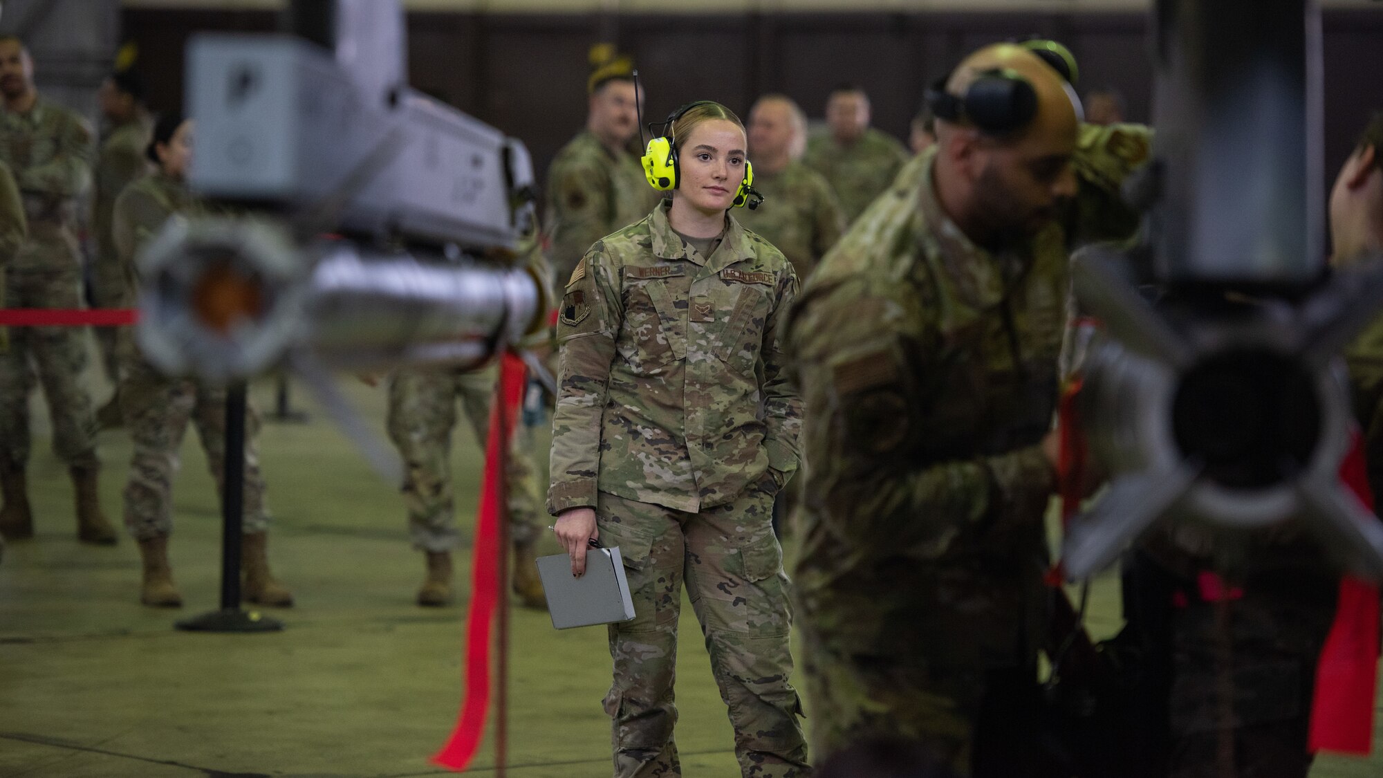 A military member participates in a load competition