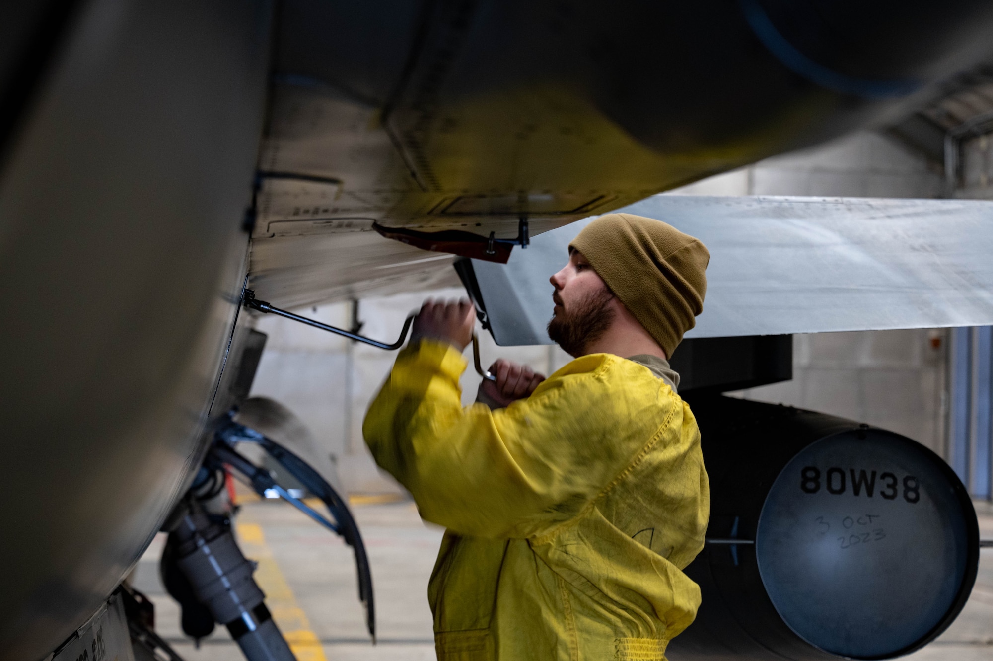 Staff Sgt. Zachary Lester, 8th Maintenance Squadron aerospace propulsion craftsman, tightens a bolt on an F-16 Fighting Falcon at Kunsan Air Base, Republic of Korea, Jan. 9, 2023. The ‘Hush House,’ allows maintenance personnel to run engines at in-flight performance levels and search for complications or issues that need correcting. (U.S. Air Force Photo by Senior Airman Shannon Braaten)