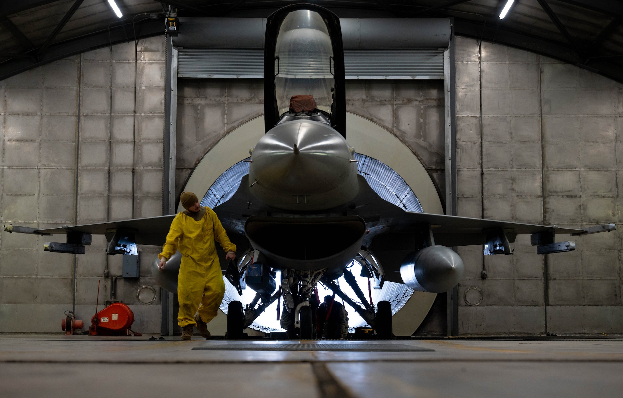 Staff Sgt. Zachary Lester, 8th Maintenance Squadron aerospace propulsion craftsman, inspects an F-16 Fighting Falcon at the ‘Hush House’ on Kunsan Air Base, Republic of Korea, Jan. 9, 2023. The Hush House is a sound dampening facility designed to test aircraft at their full capabilities without launch or noise constraints.  (U.S. Air Force Photo by Senior Airman Shannon Braaten)