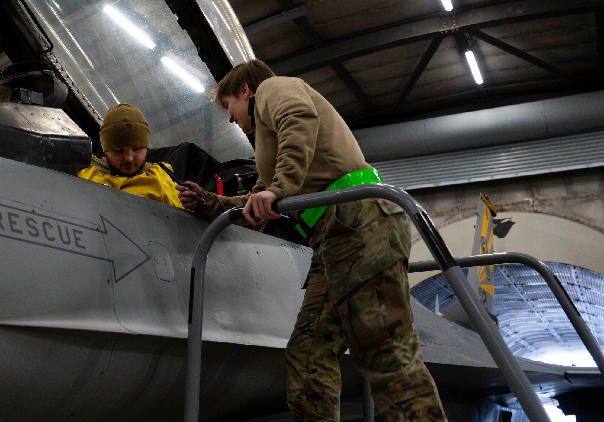 Staff Sgt. Zachary Lester (left) and Senior Airman Mariah Owens (right), both 8th Maintenance Squadron aerospace propulsion specialists, prepare an F-16 Fighting Falcon for a test burn at Kunsan Air Base, Republic of Korea, Jan. 9, 2023. The ‘Hush House,’ allows maintenance personnel to run engines at in-flight performance levels and search for complications or issues that need correcting. (U.S. Air Force Photo by Senior Airman Shannon Braaten)