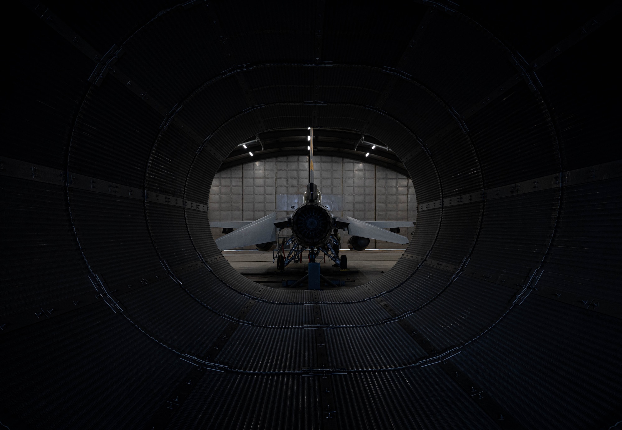 An F-16 Fighting Falcon sits inside the ‘Hush House’ at Kunsan Air Base, Republic of Korea, Jan. 9, 2023. On average, engines at the Wolf Pack are tested 30 to 40 times a year to mitigate future issues and ensure peak performance. (U.S. Air Force Photo by Senior Airman Shannon Braaten)