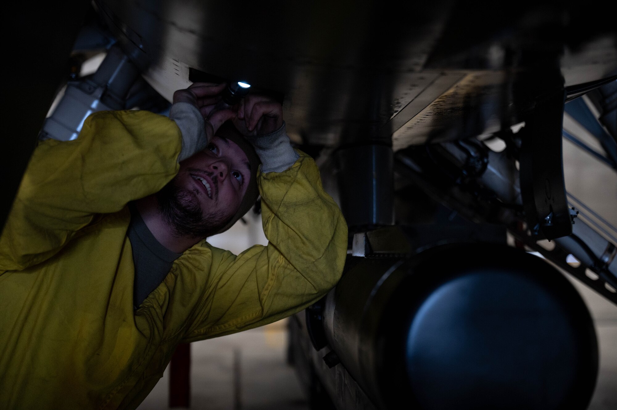 Staff Sgt. Zachary Lester, 8th Maintenance Squadron aerospace propulsion craftsman, inspects an F-16 Fighting Falcon at Kunsan Air Base, Republic of Korea, Jan. 9, 2023. Engines are tested inside of ‘hush houses’ to minimize noise and provide a safe area for aerospace propulsion Airmen to inspect them. (U.S. Air Force Photo by Senior Airman Shannon Braaten)