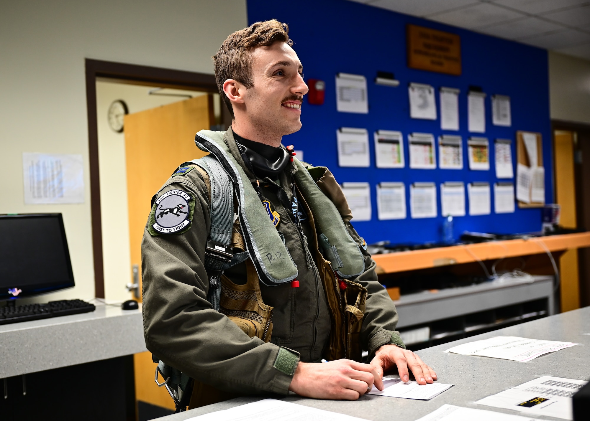 Pilot receives pre-flight briefing.