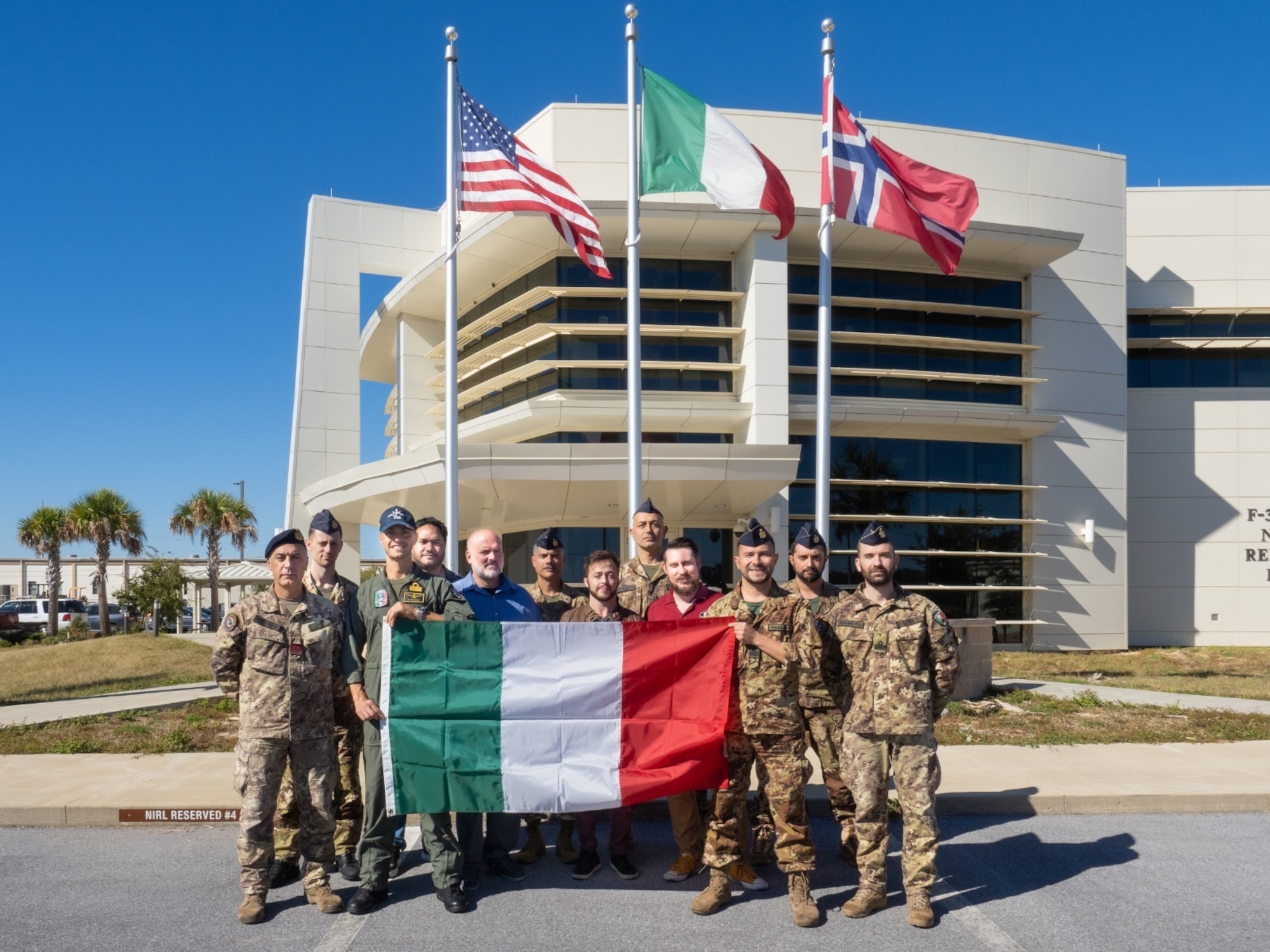 Members of the Italian military pose for a photo outside the F-35 Norway / Italy Reprogramming Facility at Eglin Air Force Base, Fla., Oct. 28, 2022. The Italian military team completed its first Mission Data File for the F-35 as part of the F-35 Partner Support Complex. (Courtesy Photo)