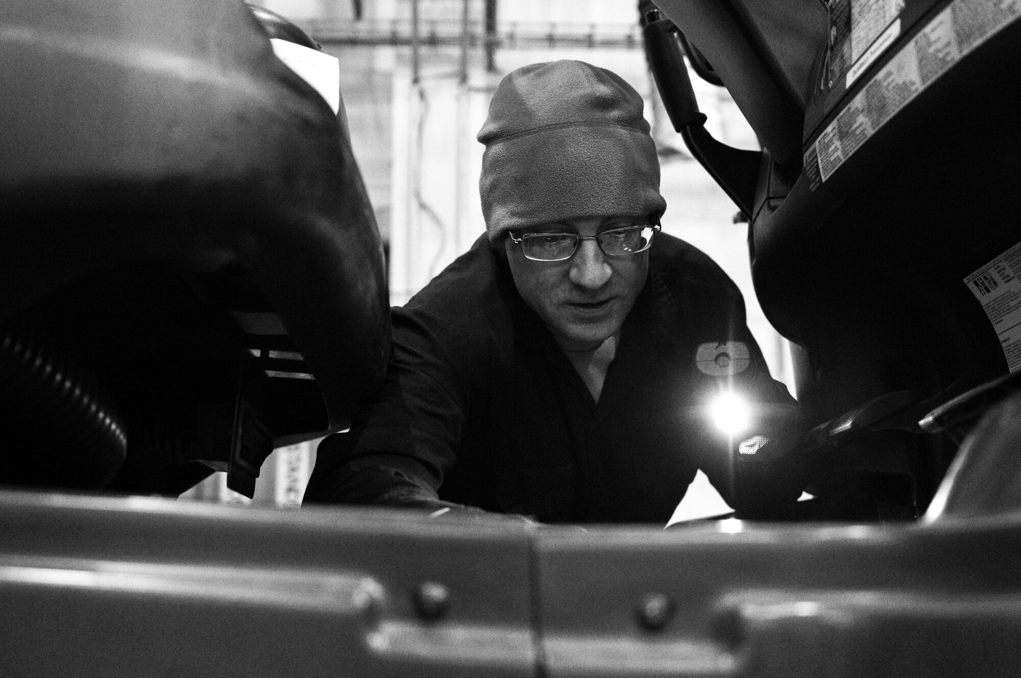 U.S. Air Force Staff Sgt. Daniel Payne, 100th Logistics Readiness Squadron NCO in charge of material handling equipment, repairs an electrical malfunction in a government vehicle at Royal Air Force Mildenhall, England, Jan. 9, 2023. Vehicle maintenance’s main objective is to service vehicles which are driven regularly on the flightline, so aircrews and maintainers can accomplish the mission. (U.S. Air Force photo by Airman 1st Class Viviam Chiu)