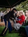 Army 1st Sgt. Naarah Stallard presents a folded flag to Paulette Ross, daughter of Master Sgt. Wilma Ross, a retiree of the Kentucky Army National Guard at the Grove Hill Cemetery in Shelbyville, Ky. on Dec. 9, 2022. Wilma Ross retired after 24 years of service and passed away at the age of 81. (U.S. Army photo by Andy Dickson)