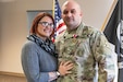 Master Sgt. (Ret.) April Bravo poses with her husband Sgt. 1st Class Louis Bravo, a career counselor for III Armored Corps Army Reserve and National Guard retention team, after he received a Meritorious Service Medal for his being named the Army's top drill sergeant career counselor during a ceremony at Ft. Hood, Texas, Jan. 9, 2023. A Rome, New York native, Bravo transitioned 24 reserve component drill sergeants, which led him to be named the most prolific drill-sergeant career counselor in the entire Army. He beat out his nearest competitor by 10. The office he works for serves a unique role in the III Armored Corps, as it gives Soldiers transitioning from the active-duty component a chance to continue serving in the Army Reserve or Army National Guard. The Bravos met while stationed together at Fort Bragg, North Carolina. (U.S. Army photo by Staff Sgt. Evan Ruchotzke)