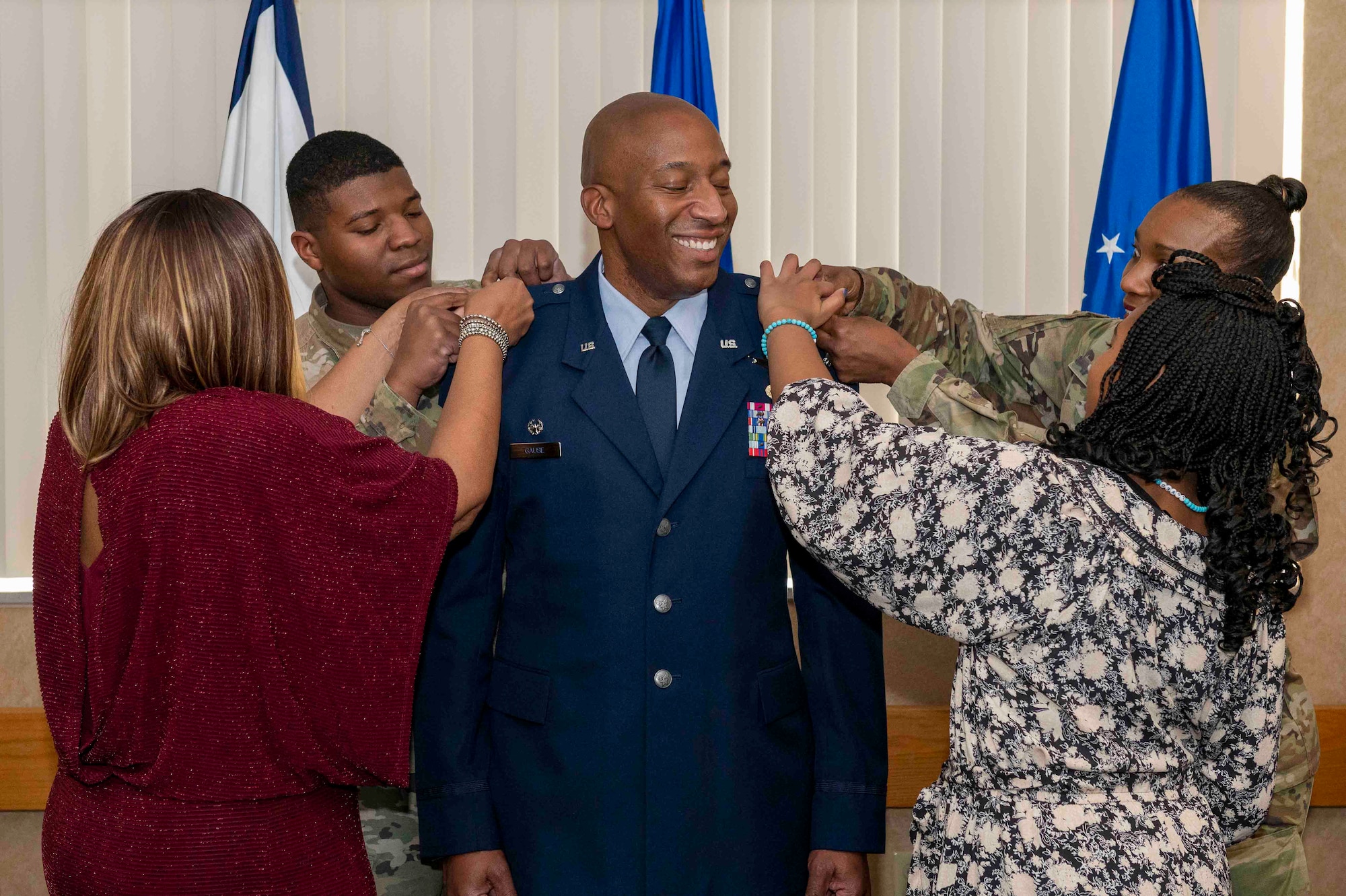 U.S. Air Force Col. Corey Gause, commander of the 167th Mission Support Group, stands surrounded by his family as they pin on his colonel rank, Jan. 7, 2023, at the 167th Airlift Wing, Martinsburg, West Virginia