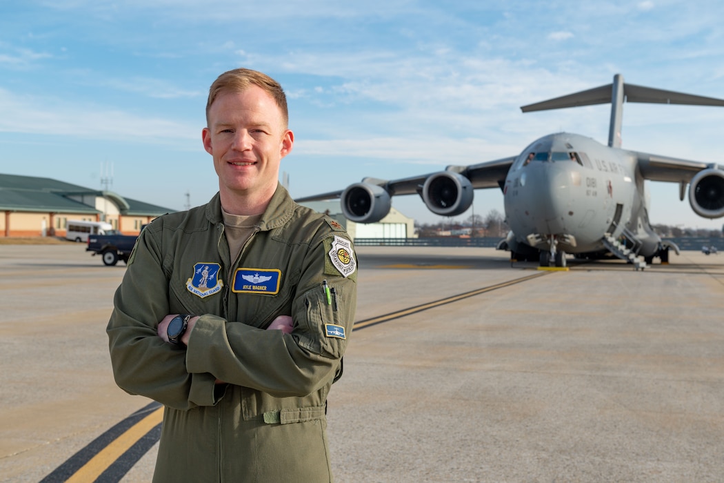 U.S. Air Force Maj. Kyle Wagner, a pilot assigned to the 167th Operations Group, poses for a photo in front of a C-17 Globemaster III aircraft at the 167th Airlift Wing, Martinsburg, West Virginia, Jan. 08, 2023