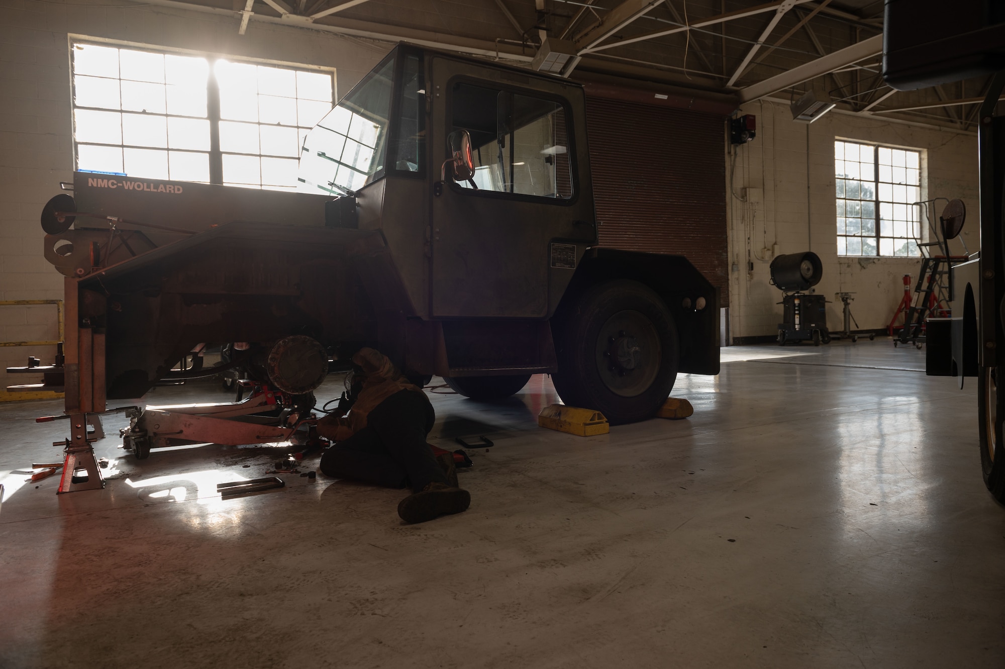 Airman 1st Class Bethwel Waitiki, 4th Logistics Readiness Squadron vehicle maintainer, works on an MB-4 towing and push back tractor at Seymour Johnson Air Force Base, North Carolina, Jan. 10, 2023. Vehicle maintenance is responsible for 587 vehicles on base, providing routine and emergency maintenance. (U.S. Air Force photo by Airman 1st Class Rebecca Sirimarco-Lang)
