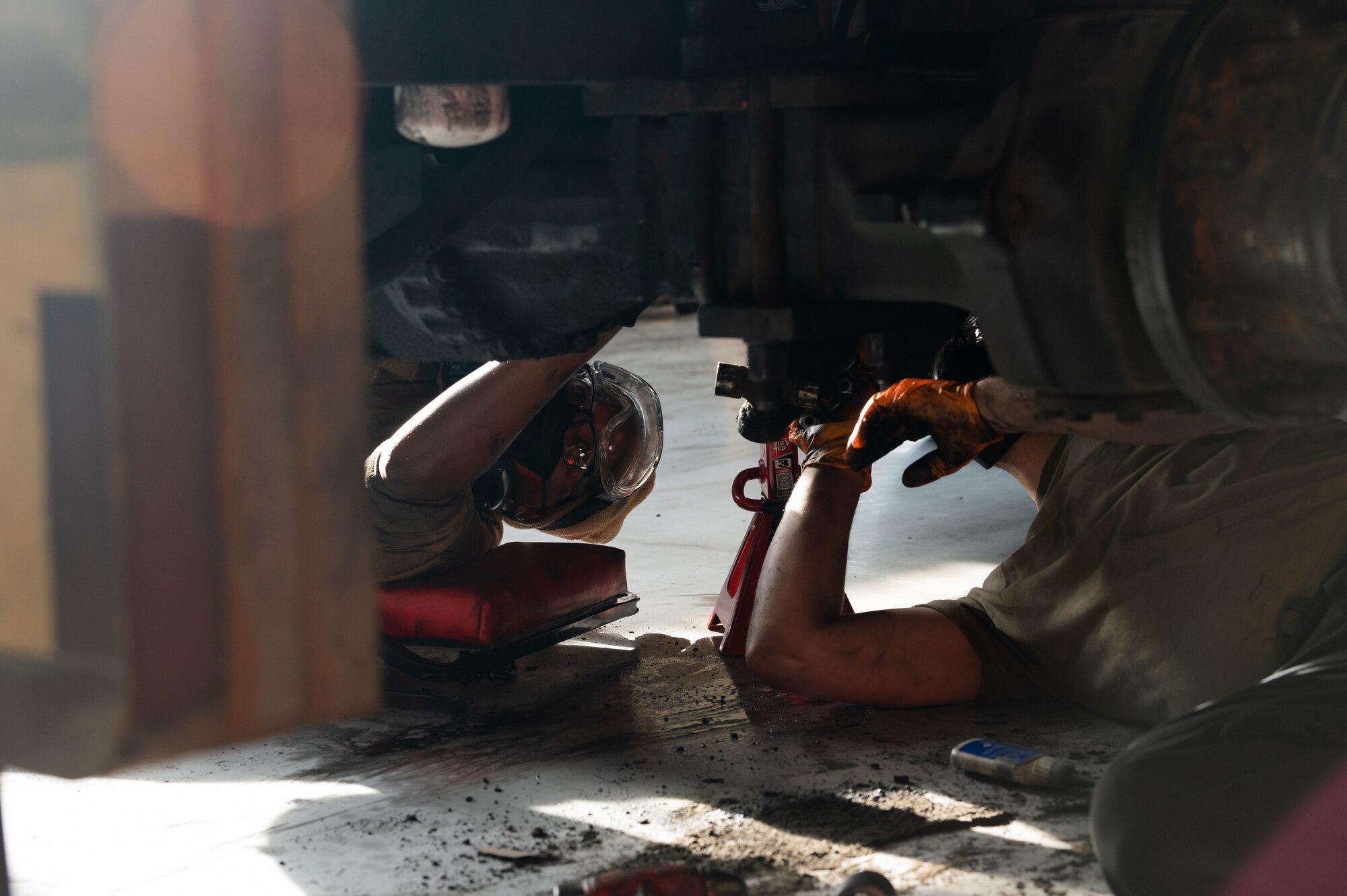 Airman 1st Class Michael Brown (right) and Airman 1st Class Bethwel Waitiki (left), both 4th Logistics Readiness Squadron vehicle maintainers, repair an MB-4 towing and push back tractor at Seymour Johnson Air Force Base, North Carolina, Jan. 10, 2023. The MB-4 has a drawbar rating of 16,000 pounds for pulling machinery. (U.S. Air Force photo by Airman 1st Class Rebecca Sirimarco-Lang)