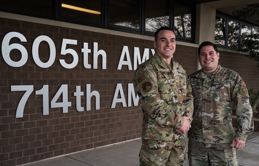 U.S. Air Force Tech. Sgt. Kenneth Oliver, 605th Aircraft Maintenance Squadron flying crew chief, left, and Master Sgt. Jeremias Ramos, 605th AMXS section chief, pose for a photo at Joint Base McGuire-Dix-Lakehurst, N.J., Dec. 14, 2022. Oliver was selected with the opportunity to commission through the Senior Leader Enlisted Commissioning Program by demonstrating exceptional leadership and performance skills.  (U.S. Air Force photo by Airman 1st Class Sergio Avalos)