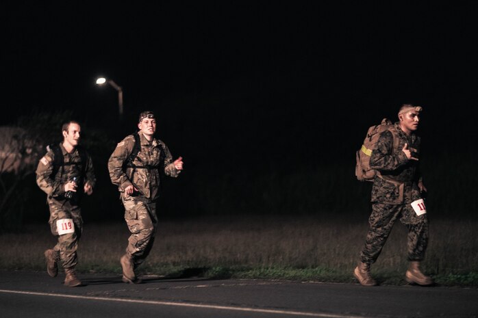 U.S. Service Members participate in the Norwegian Foot March, Marine Corps Base Hawaii, Dec. 21, 2022. The Norwegian Foot March originated as a test of marching endurance for soldiers in the Norwegian military in 1915, and today, aims to stimulate the general interest of marching over extended distances amongst military and civilian personnel. (U.S. Marine Corps photo by Cpl. Christian Tofteroo)