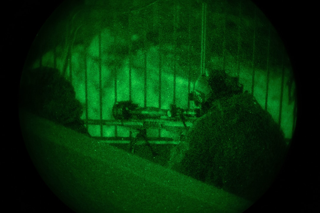 U.S. Marine Corps Cpl. Kyle Tullis, with Amphibious Reconnaissance Platoon sniper team, 31st Marine Expeditionary Unit, awaits to shoot a simulated target during a training raid at Wet n’ Wild Water Park, part of Realistic Urban Training Exercise 23.1 in Kapolei, Hawaii, Jan. 10, 2023. The purpose of RUTEX is to incorporate the specialized individual and small unit skills of the MEU and conduct high-intensity, advanced, and complex Marine Air Ground Task Force operations in order to prepare MEUs and other designated forces to support the geographic combatant commanders. (U.S. Marine Corps photo by Lance Cpl. Clayton Baker)