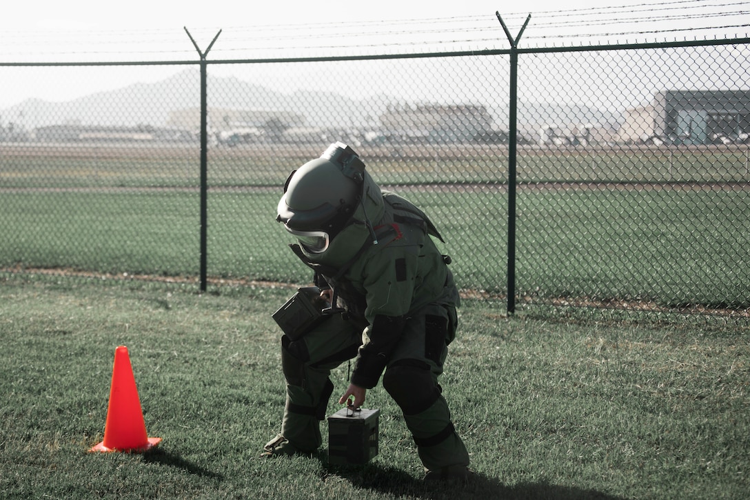 U.S. Marine Corps Cpl. Triston Gilpin, communications and navigation systems technician, Marine Aviation Logistics Squadron 24, begins the ammunition can carry portion of the bomb suit agility test as part of the Explosive Ordinance Disposal screening process, Marine Corps Base Hawaii, Jan. 10, 2023. The purpose of the event was to demonstrate EOD’s capabilities, test the capabilities of the Marines participating in the screening, and recruit new members.(U.S. Marine Corps photo by Lance Cpl. Terry Stennett III)