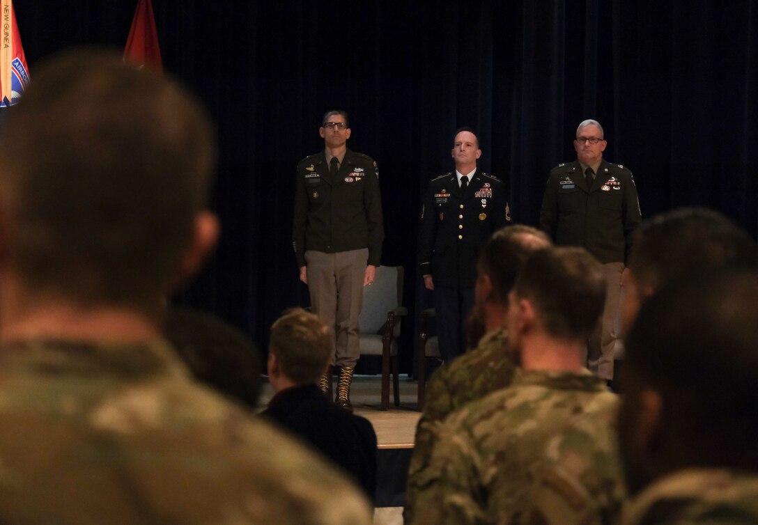 Arctic Angels stand at the end of a ceremony to present the Soldier's Medal to Army Sgt. 1st Class Andrew Chapoton, 11th Airborne Division, at Joint Base Elmendorf-Richardson, Alaska, Jan. 12.